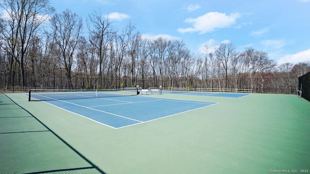 view of sport court with basketball hoop