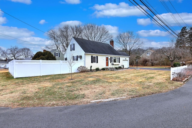 view of side of property featuring a yard