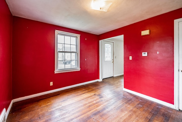 spare room featuring hardwood / wood-style flooring