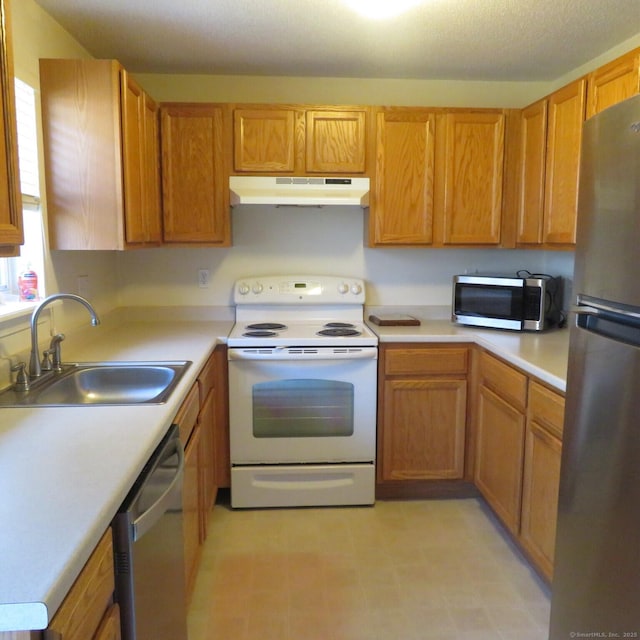 kitchen with sink and appliances with stainless steel finishes