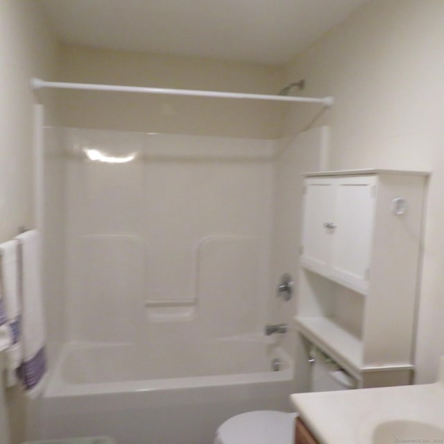 full bathroom with shower / tub combination, vanity, and toilet