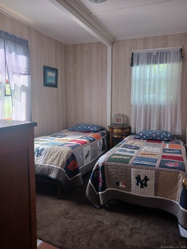 bedroom featuring wooden walls