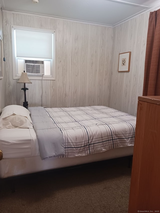 bedroom featuring carpet flooring, wood walls, and cooling unit