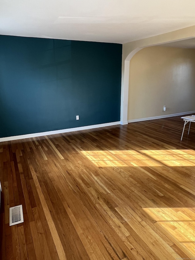 empty room featuring hardwood / wood-style flooring