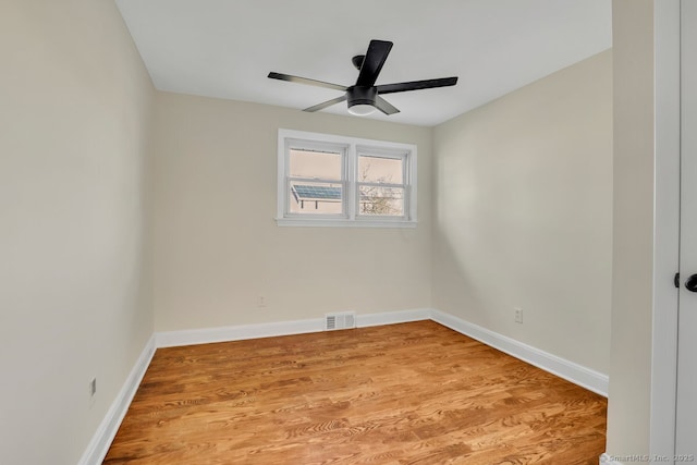 empty room featuring ceiling fan and light wood-type flooring