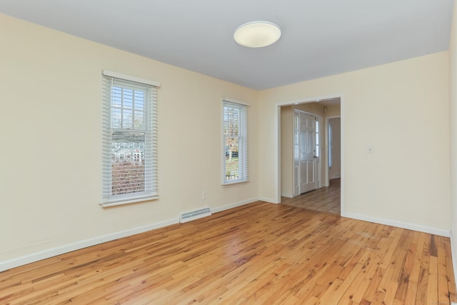 spare room with light hardwood / wood-style floors