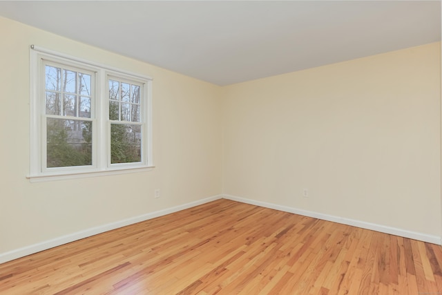 spare room with light wood-type flooring