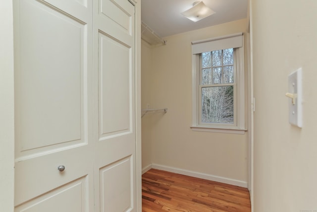 spacious closet with light hardwood / wood-style floors