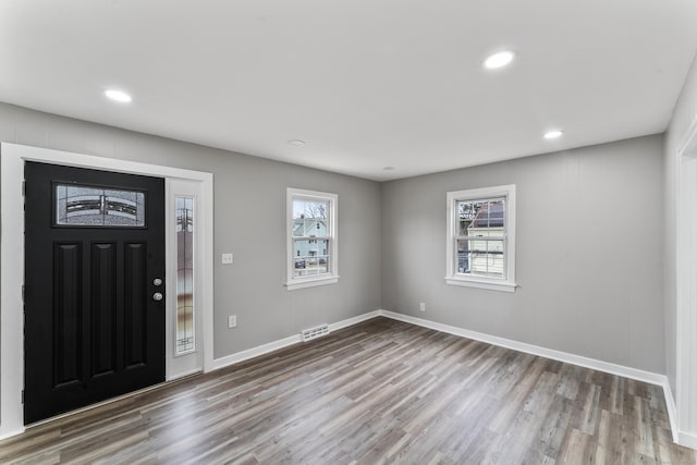 foyer entrance with hardwood / wood-style flooring