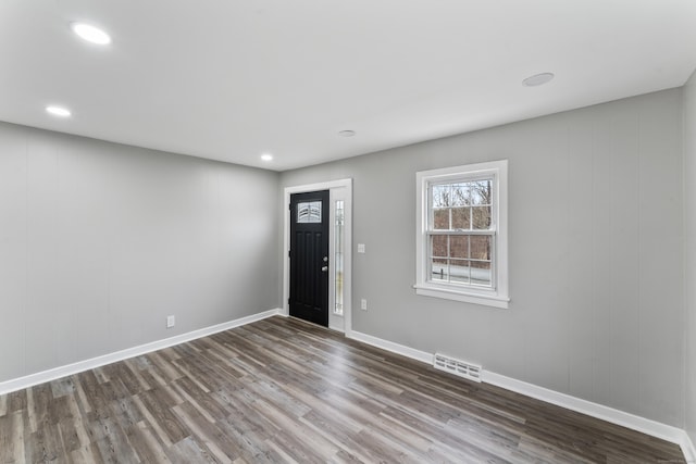 entryway with dark wood-type flooring