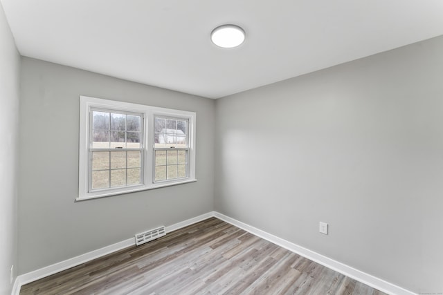 empty room with light wood-type flooring