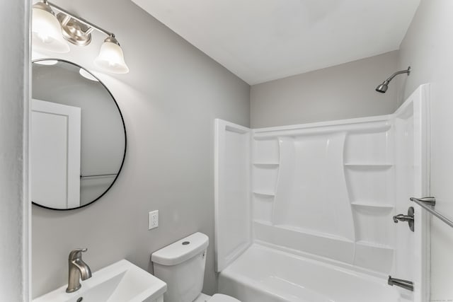 full bathroom featuring shower / bathing tub combination, toilet, and sink