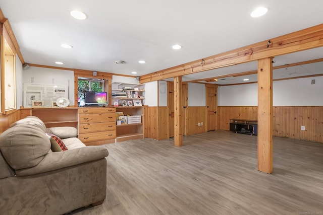 living room featuring wood walls and hardwood / wood-style floors