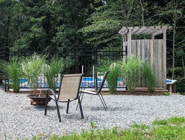 view of playground with an outdoor fire pit