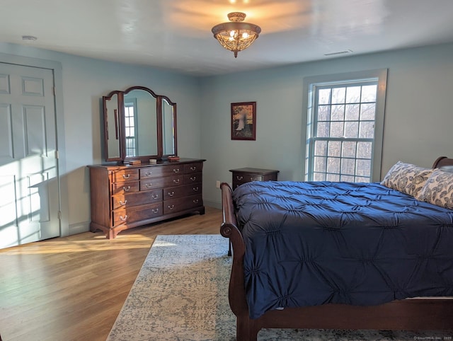 bedroom with light wood-type flooring