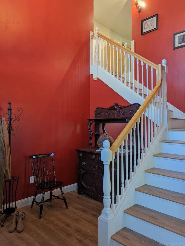 staircase featuring wood-type flooring