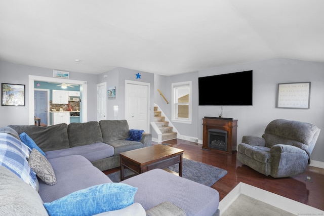 living room with hardwood / wood-style floors and ceiling fan