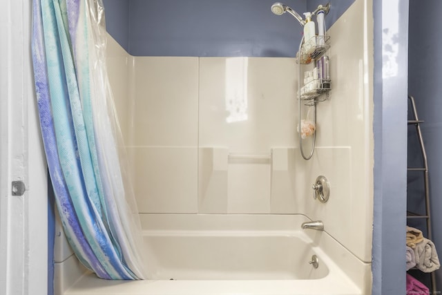 bathroom with shower / tub combo with curtain