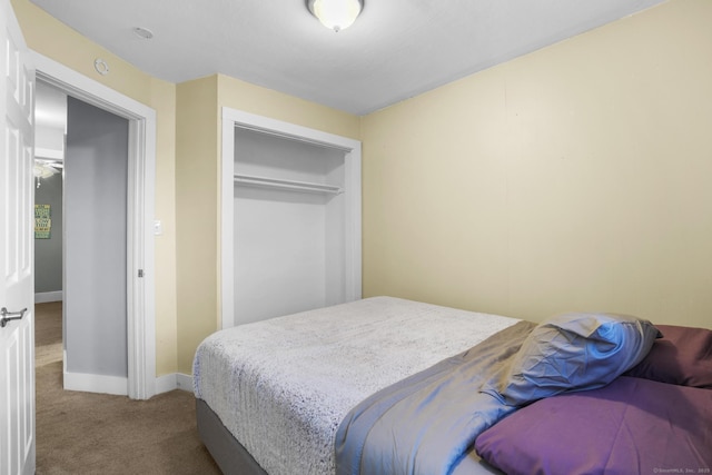 carpeted bedroom featuring a closet