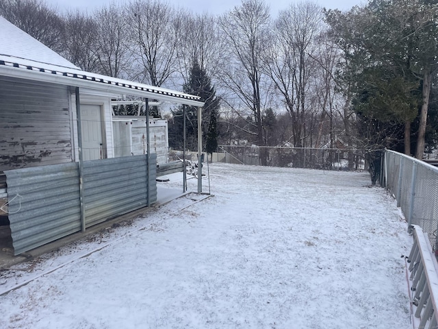 view of yard covered in snow