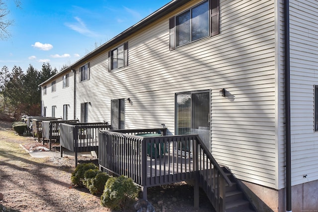 back of house featuring a deck