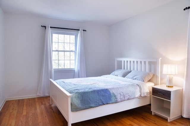 bedroom with wood finished floors