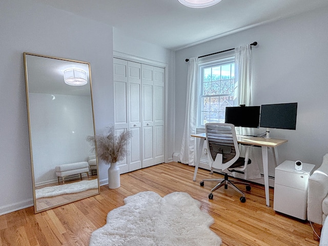 office with wood finished floors and baseboards