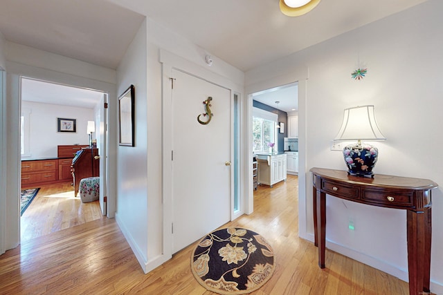 corridor featuring light hardwood / wood-style floors