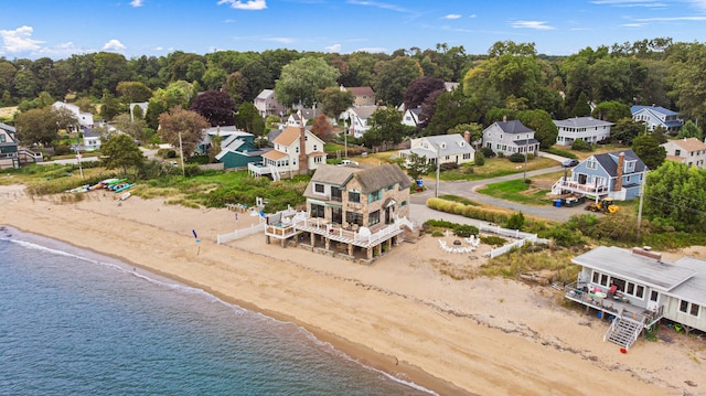 birds eye view of property featuring a residential view, a water view, and a beach view