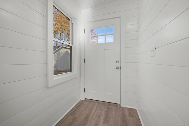 doorway to outside with light wood-type flooring