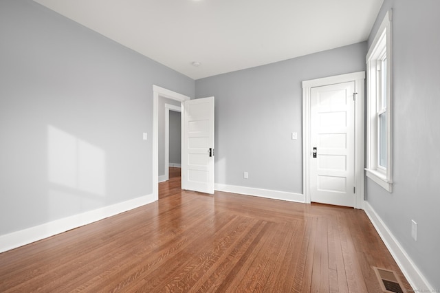 empty room featuring wood-type flooring