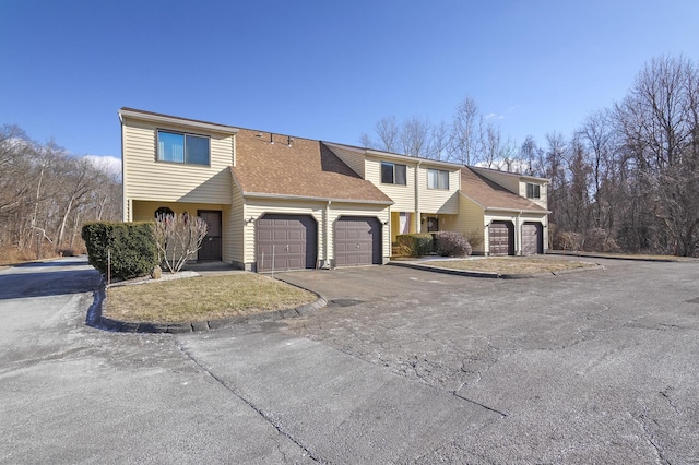 front of property with a garage