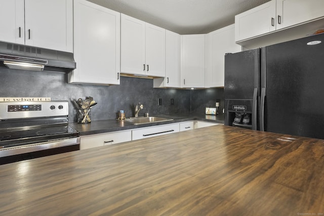 kitchen featuring black refrigerator with ice dispenser, white cabinetry, and wood counters