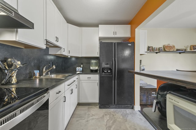 kitchen with a textured ceiling, black appliances, white cabinetry, sink, and backsplash