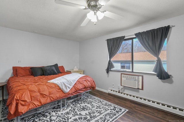 bedroom featuring ceiling fan, a baseboard radiator, wood-type flooring, and a wall unit AC