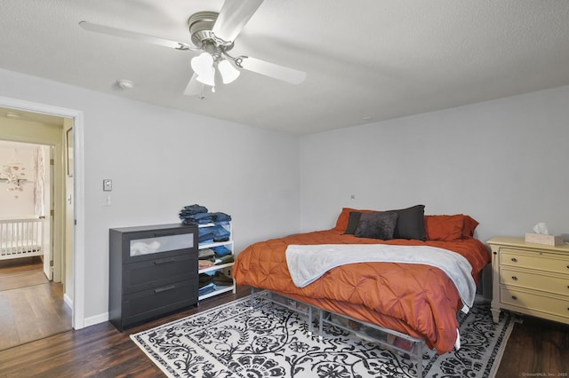 bedroom featuring ceiling fan and dark hardwood / wood-style flooring