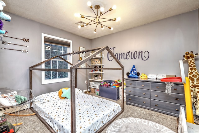 carpeted bedroom featuring a textured ceiling and an inviting chandelier