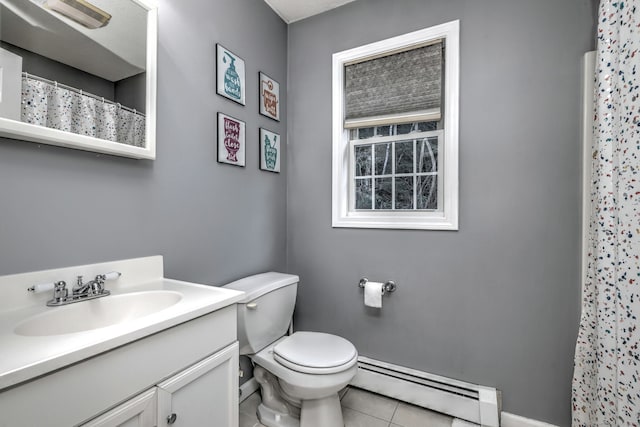 bathroom featuring tile patterned floors, vanity, a baseboard radiator, and toilet