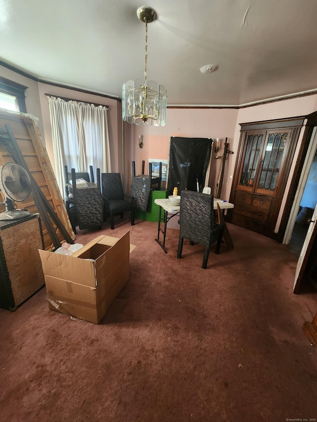 dining space with dark colored carpet, a notable chandelier, and a wealth of natural light