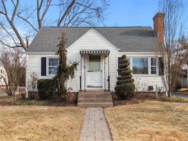 bungalow-style house featuring a front yard