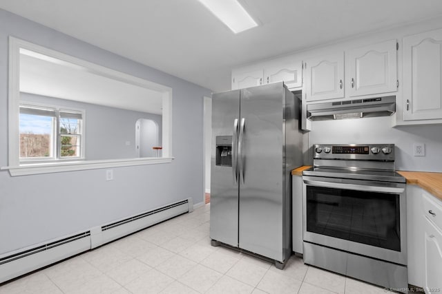 kitchen featuring white cabinets, a baseboard radiator, light tile patterned floors, and appliances with stainless steel finishes