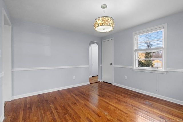 unfurnished room featuring wood-type flooring