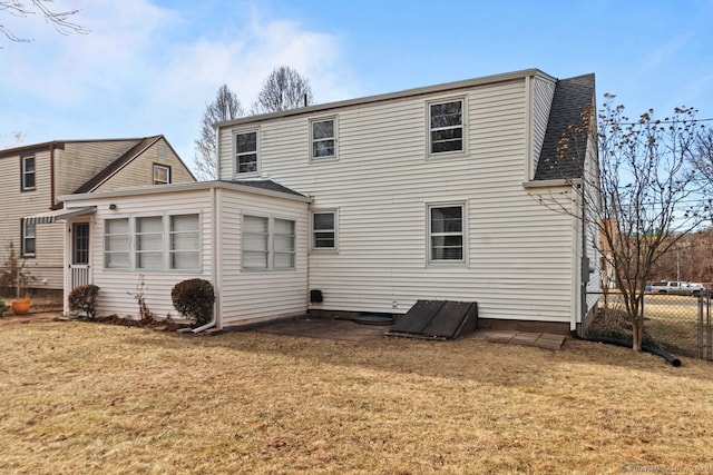 rear view of house with a lawn