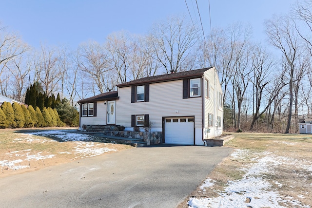 view of front of property featuring a garage