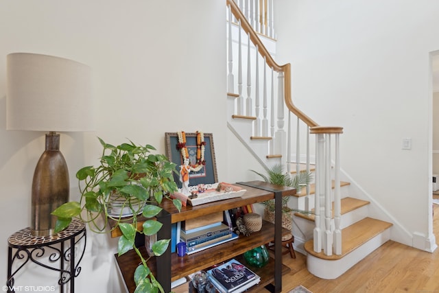 staircase featuring hardwood / wood-style floors