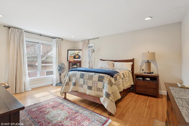 bedroom with light hardwood / wood-style floors