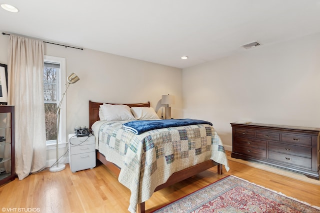 bedroom with light wood-type flooring