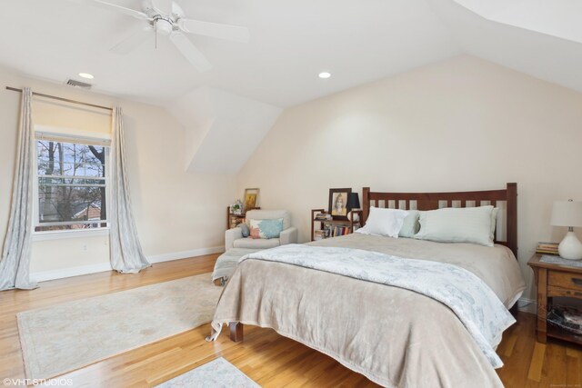 bedroom featuring vaulted ceiling, hardwood / wood-style floors, and ceiling fan