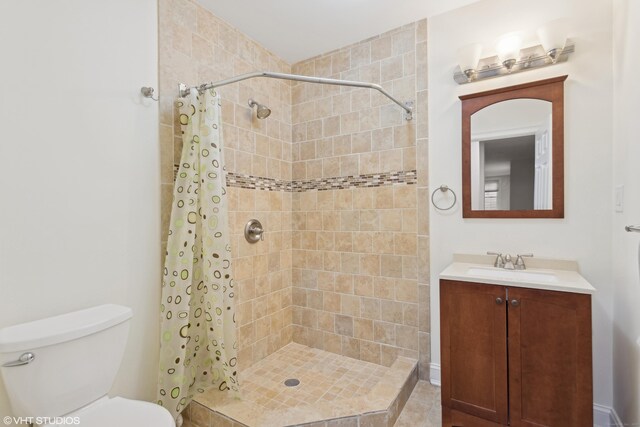 bathroom featuring vanity, toilet, and a shower with shower curtain