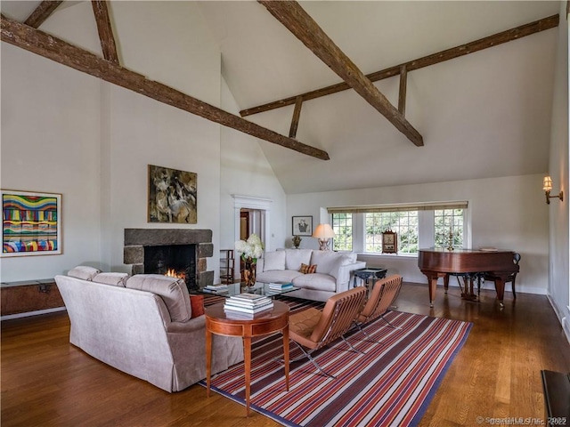 living room featuring beamed ceiling, dark hardwood / wood-style flooring, a fireplace, and high vaulted ceiling